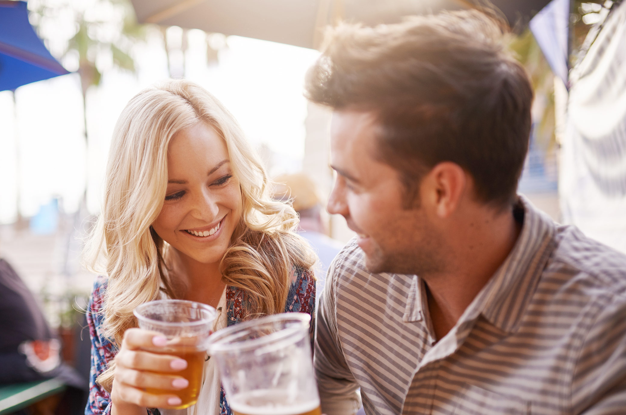 man and woman drinking beer