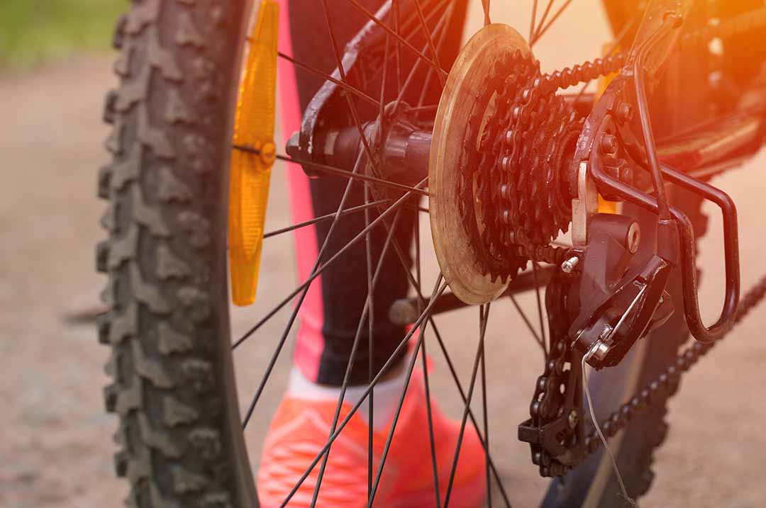 Image of a biker ready to take on a trail - here are some great rails to trails locations out west.