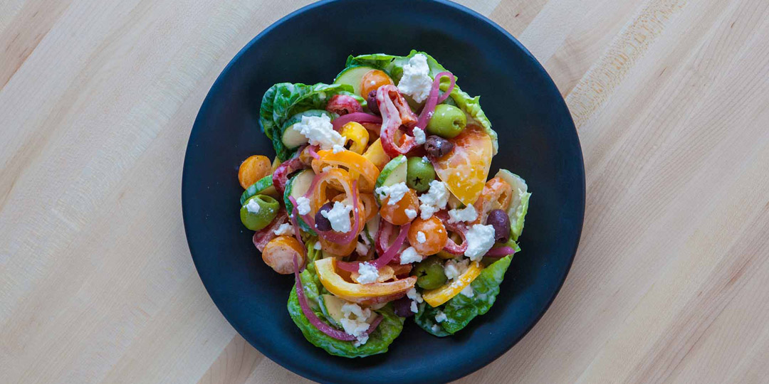 Image of a greek salad at Sachet - one of many fun places to go in Dallas