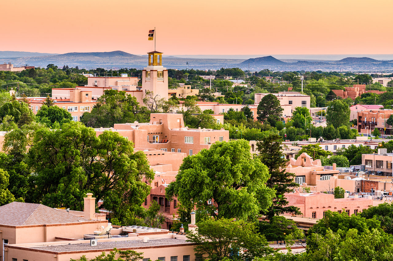 Downtown skyline of Santa Fe, New Mexico at dusk.