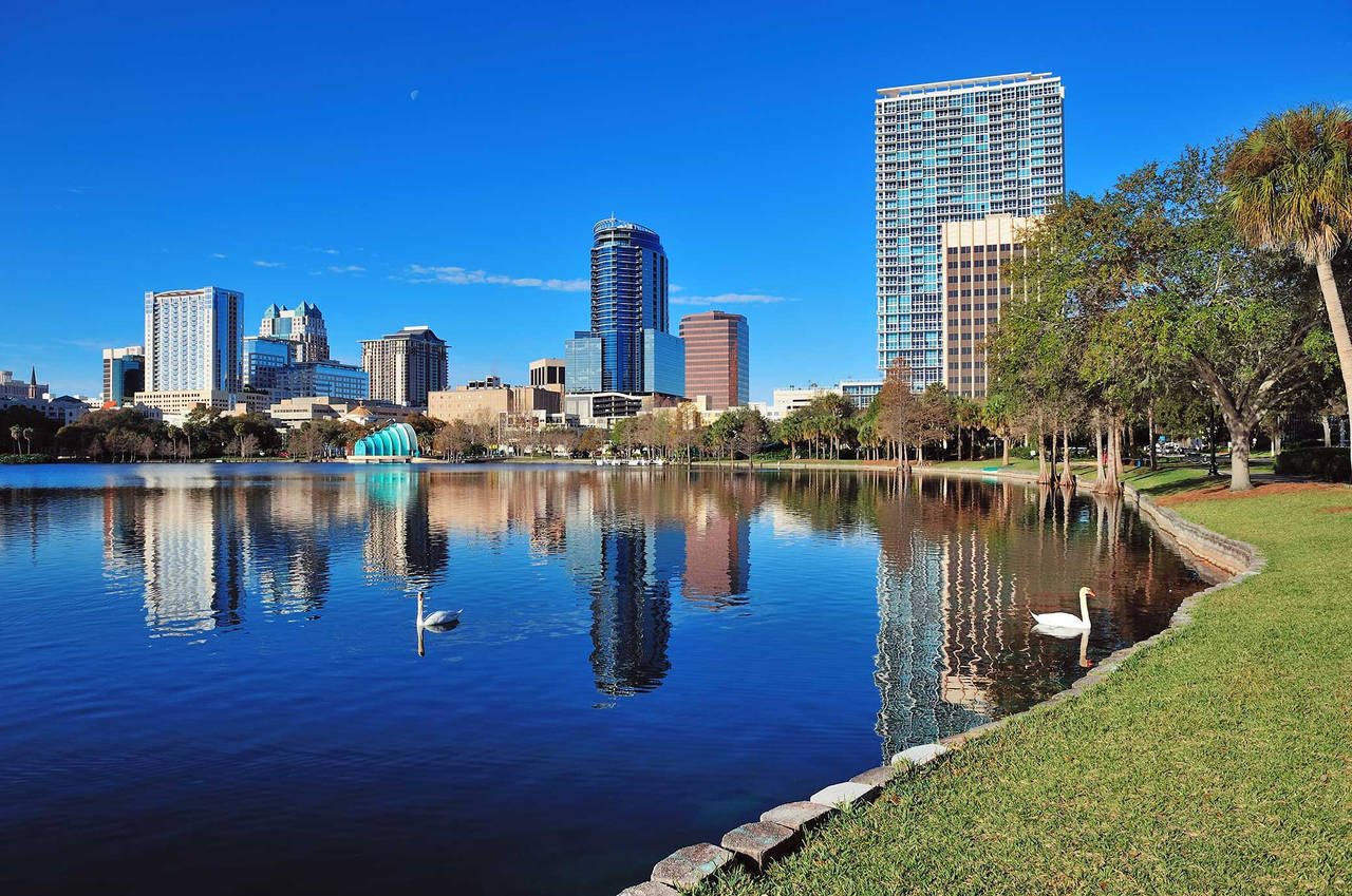 lake in front of Orlando skyline