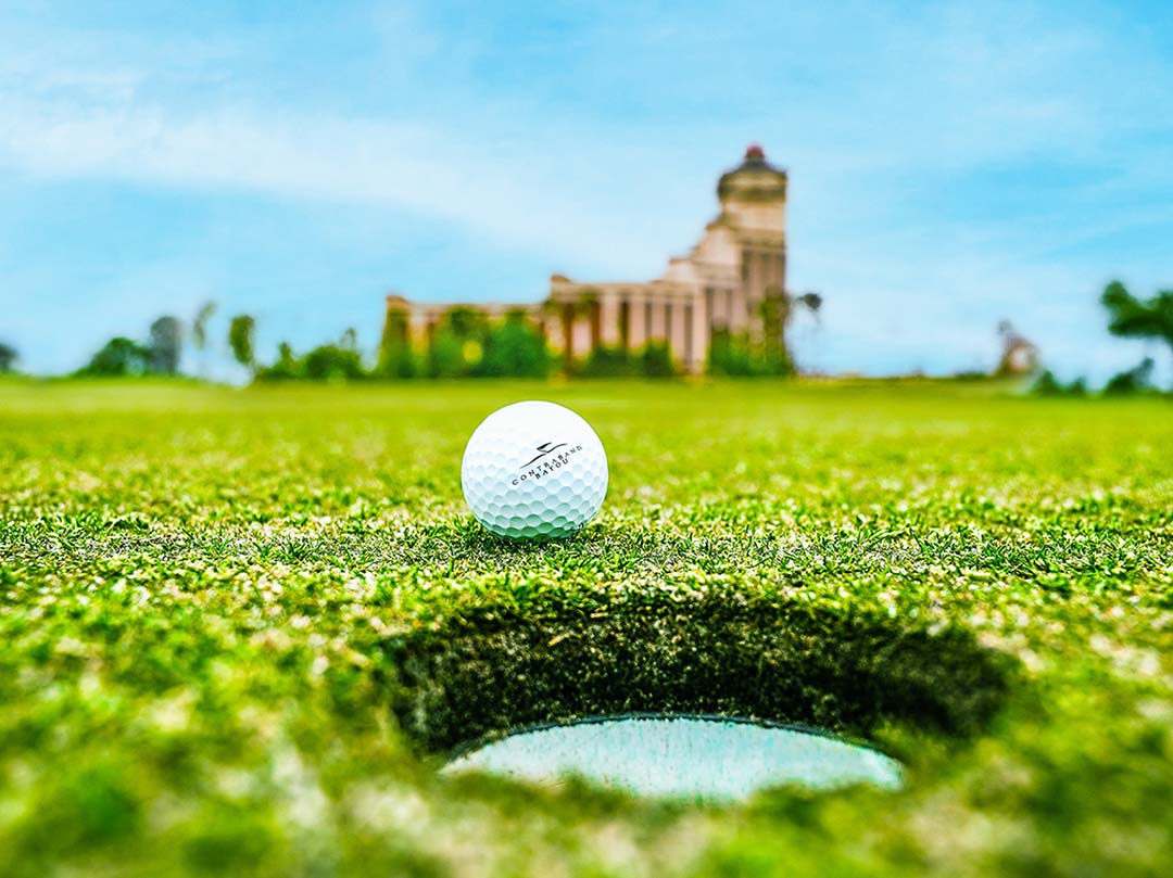 golf course with hotel in background