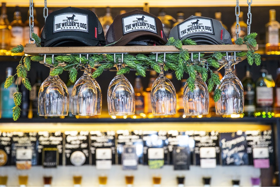 Merchandise on the bar at the Welder's Dog, Armidale.