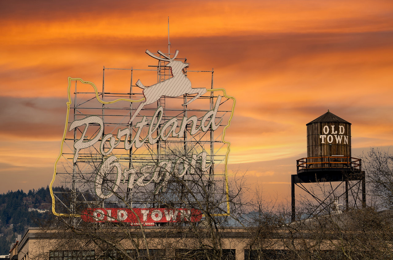 Iconic Portland Oregon sign and wooden water tower in Old Town, Portland, Oregon.