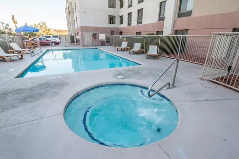 Outdoor pool with hot tub | Comfort Inn in Phoenix, AZ