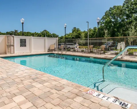 Outdoor pool | Comfort Inn Suites Hotel in Dunnellon, FL