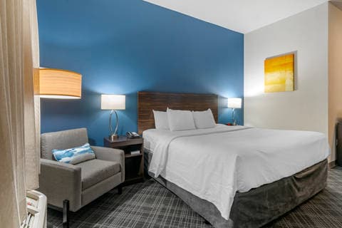 Guest room with sitting area | Comfort Inn, Bridgeton MO Hotels