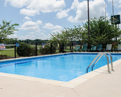 Outdoor pool | Quality Inn hotel in Louisville, MS