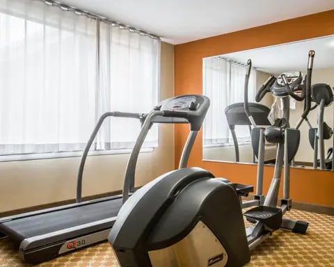 Exercise room with cardio equipment and weights | Ossipee, NH Hotels | Econo Lodge Lake Region