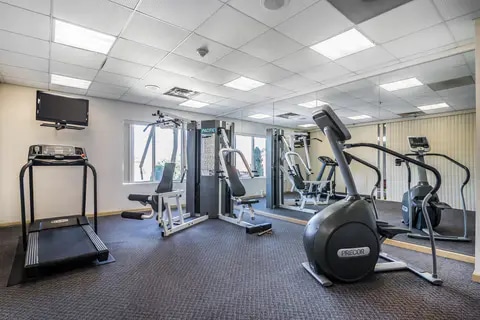 Fitness center with television | Quality Inn, Latham NY Hotels