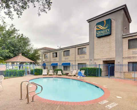 Outdoor pool with sundeck | Quality Inn and Suites, Grand Prairie TX Hotels