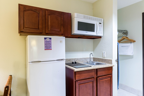 Guest room with kitchen area | Suburban, Beaumont TX Hotels